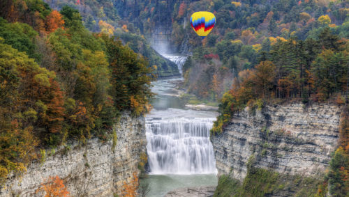 A picture of a hot air balloon floating over Letchworth State Park